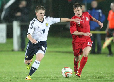 311013 - Wales v Scotland Under 16 Victory Shield International, Aberystwyth - Scotland's Mackenzie Heaney holds off Wales' Joe McNulty