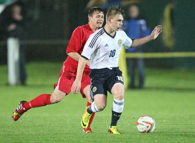 311013 - Wales v Scotland Under 16 Victory Shield International, Aberystwyth - Scotland's Mackenzie Heaney holds off Wales' Joe McNulty