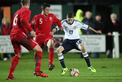 311013 - Wales v Scotland Under 16 Victory Shield International, Aberystwyth - Scotland's Joshua Laws holds off Wales' Rhyle Ovenden