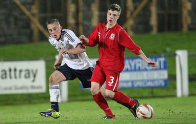 311013 - Wales v Scotland Under 16 Victory Shield International, Aberystwyth - Scotland's Calvin Miller and Wales' Rhys Abbruzzese compete for the ball
