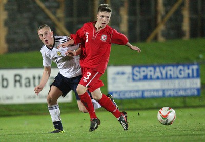 311013 - Wales v Scotland Under 16 Victory Shield International, Aberystwyth - Scotland's Calvin Miller and Wales' Rhys Abbruzzese compete for the ball