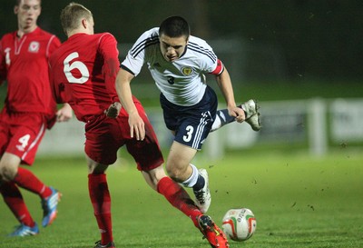 311013 - Wales v Scotland Under 16 Victory Shield International, Aberystwyth - Scotland's Leon Jones is tackled by Wales' Sam Williams