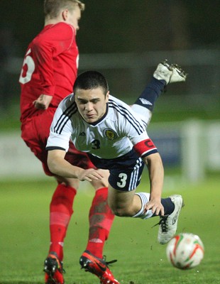 311013 - Wales v Scotland Under 16 Victory Shield International, Aberystwyth - Scotland's Leon Jones is tackled by Wales' Sam Williams