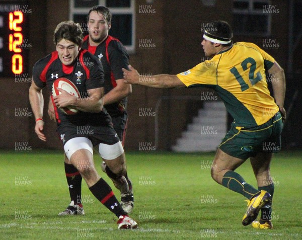 221113 - Wales U18s (A) v Australia Schools U18s -Garyn Smith of Wales is challenged by Keith Morgan of Australia