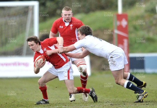 100311 - Wales U18 v England U18 - Dan Brooks of Wales is tackled by England's Will Owen 