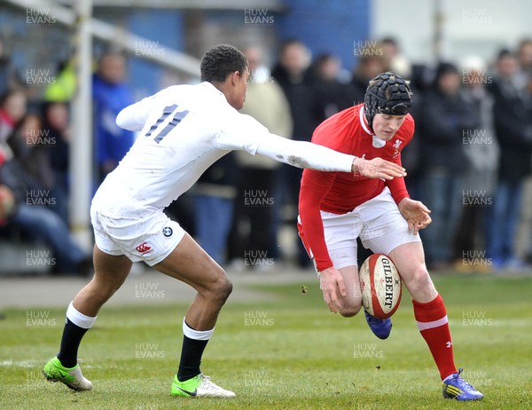 100311 - Wales U18 v England U18 - Dafydd Howells of Wales is tackled by England's Nathan Earle 