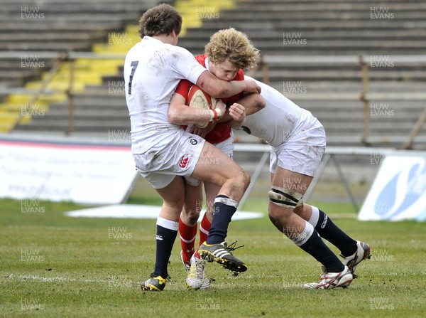 100311 - Wales U18 v England U18 - Angus O'Brien of Wales is tackled by England's Will Owen, left, and Lewis Ludlow 