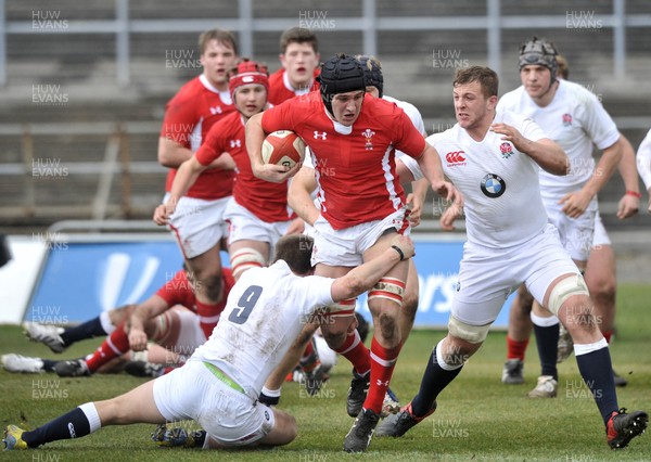 100311 - Wales U18 v England U18 - Oliver Griffiths of Wales is tackled by England's  Stuart Townsend, left, and Hayden Stringer 