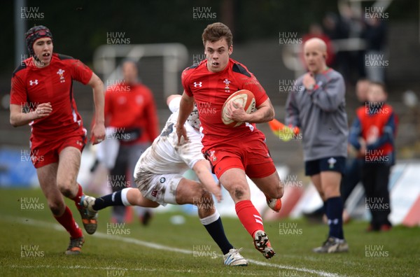 150315 - Wales Under 18s v England Under 18s -Shaun Pearce of Wales beats tackle by Curtis Langdon of England