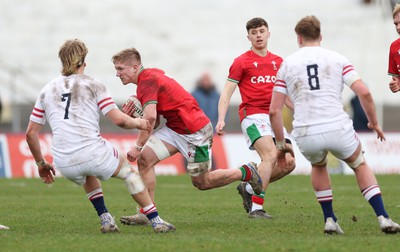 260323 - Wales U18 v England U18 - Harry Beddall of Wales charges at the England defence