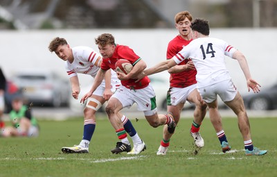 260323 - Wales U18 v England U18 - Tom Bowen of Wales breaks past Tom Humphreys of England