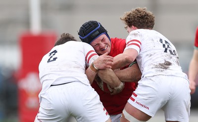 260323 - Wales U18 v England U18 - Saul Hurley of Wales takes on Jacob Oliver of England and Conor Byrne of England