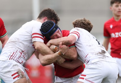 260323 - Wales U18 v England U18 - Saul Hurley of Wales takes on Jacob Oliver of England and Conor Byrne of England