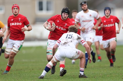 260323 - Wales U18 v England U18 - Evan Minto of Wales charges at Conor Byrne of England