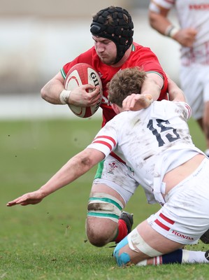 260323 - Wales U18 v England U18 - Evan Minto of Wales charges at Conor Byrne of England