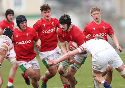 260323 - Wales U18 v England U18 - Nick Thomas of Wales is tackled short of the line