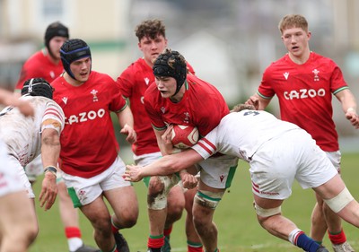 260323 - Wales U18 v England U18 - Nick Thomas of Wales is tackled short of the line