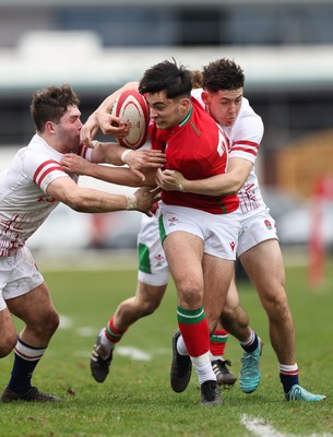 260323 - Wales U18 v England U18 - Elijah Evans of Wales is held by the England defence