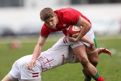 260323 - Wales U18 v England U18 - Steffan Emanuel of Wales is tackled