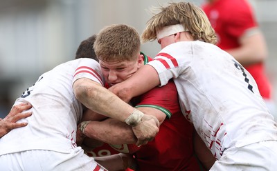 260323 - Wales U18 v England U18 - Harry Beddall of Wales takes on Jacob Oliver of England and Henry Pollock of England