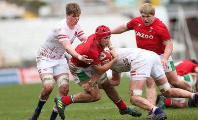 260323 - Wales U18 v England U18 - Kenzie Jenkins of Wales is tackled