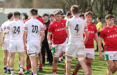 260323 - Wales U18 v England U18 - The Wales and England teams congratulate each other at the end of the match