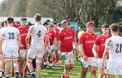 260323 - Wales U18 v England U18 - The Wales and England teams congratulate each other at the end of the match