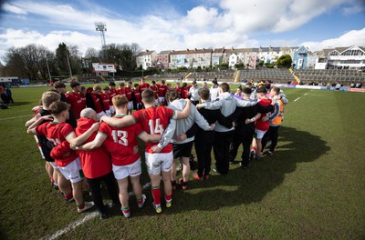 260323 - Wales U18 v England U18 - The Wales team huddle together at the end of there match