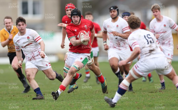 260323 - Wales U18 v England U18 - Evan Minto of Wales charges at Conor Byrne of England