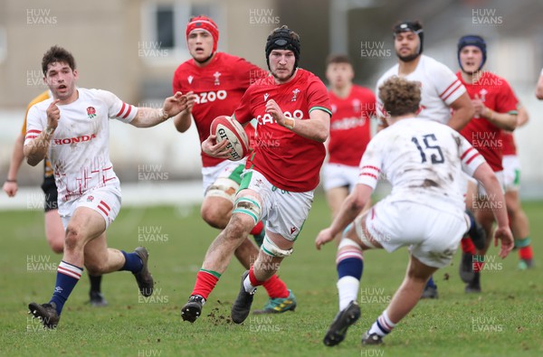 260323 - Wales U18 v England U18 - Evan Minto of Wales charges at Conor Byrne of England