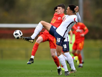 290321 - Wales U18 v England U18 - Under 18 International Match - Joel Cotterill of Wales competes with Aaron Ramsey of England