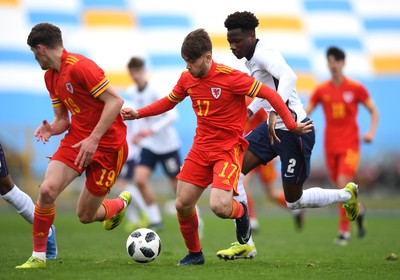 290321 - Wales U18 v England U18 - Under 18 International Match - Rio Dyer of Wales is tackled by Daniel Oyegoke of England