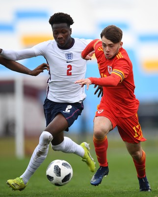 290321 - Wales U18 v England U18 - Under 18 International Match - Rio Dyer of Wales is tackled by Daniel Oyegoke of England