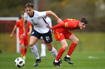 290321 - Wales U18 v England U18 - Under 18 International Match - Callum Doyle of England and Joel Cotterill of Wales