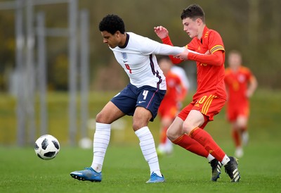 290321 - Wales U18 v England U18 - Under 18 International Match - CJ Egan-Riley of England and Joel Cotterill of Wales