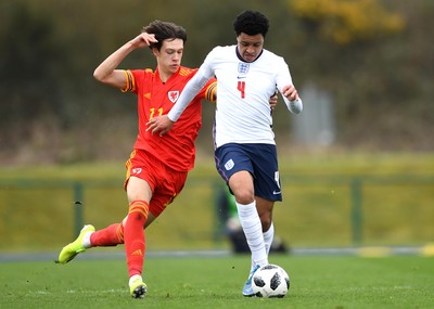 290321 - Wales U18 v England U18 - Under 18 International Match - CJ Egan-Riley of England and Chris Popov of Wales