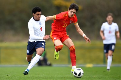 290321 - Wales U18 v England U18 - Under 18 International Match - CJ Egan-Riley of England and Chris Popov of Wales