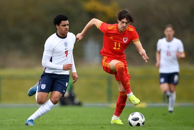 290321 - Wales U18 v England U18 - Under 18 International Match - CJ Egan-Riley of England and Chris Popov of Wales