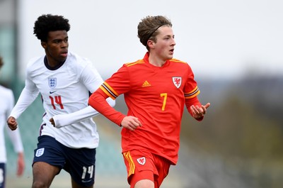 290321 - Wales U18 v England U18 - Under 18 International Match - Carney Chukwuemeka of England and Charlie Savage of Wales