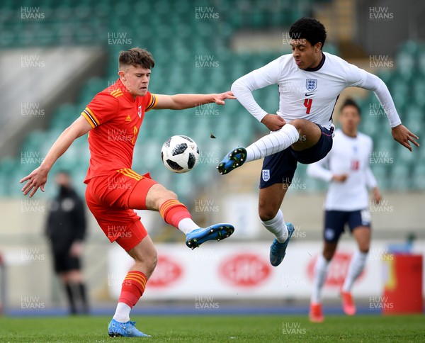 290321 - Wales U18 v England U18 - Under 18 International Match - Ryan Viggars of Wales is challenged by CJ Egan-Riley of England 