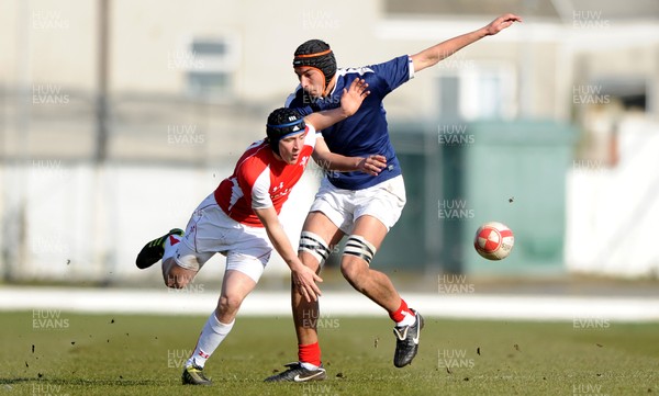 06.03.11 - Wales Under 18 v France Under 18 - Sam Davies of Wales is tackled by Steevy Cerqueira of France. 