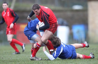 24.02.08 .. Wales U18 XV v France U18 Academy, Ebbw Vale -  Wales' Daniel Watchurst is brought down by the French defence 