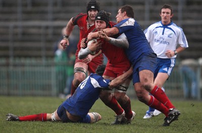 24.02.08 .. Wales U18 XV v France U18 Academy, Ebbw Vale -  Wales' Dave Francis is brought down 