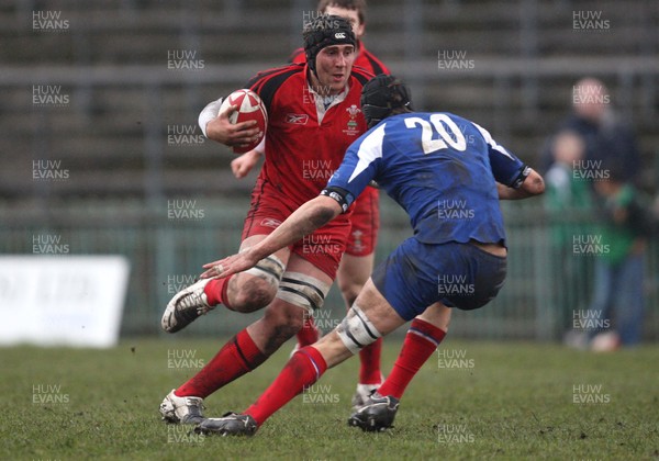 24.02.08 .. Wales U18 XV v France U18 Academy, Ebbw Vale -  Wales' Dave Francis takes on Adrien Gach 