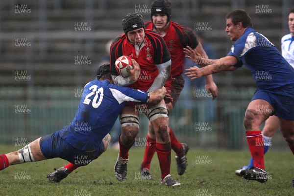24.02.08 .. Wales U18 XV v France U18 Academy, Ebbw Vale -  Wales' Dave Francis takes on Adrien Gach 