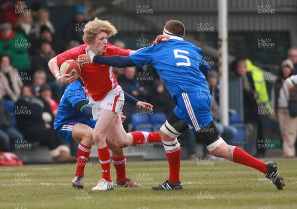 240213 Wales U18 v France U18 - U18 Championship -Wales' Angus O'Brien hands off France's Julian Delannoy 