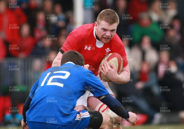 240213 Wales U18 v France U18 - U18 Championship -Wales' Tom Phillips takes on France's Francois Fontaine 