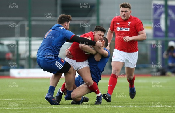 310318 - Wales U18 v France U18, U18s Six Nations Festival, Ystrad Mynach - Will Griffiths of Wales is stopped by the French defence