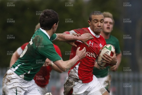 02.04.10 Ireland U18 v Wales U18 - Under 18s 5 Nations Festival -  Wales' Eli Walker tries to hand off Ireland's Charlie Simpson. 