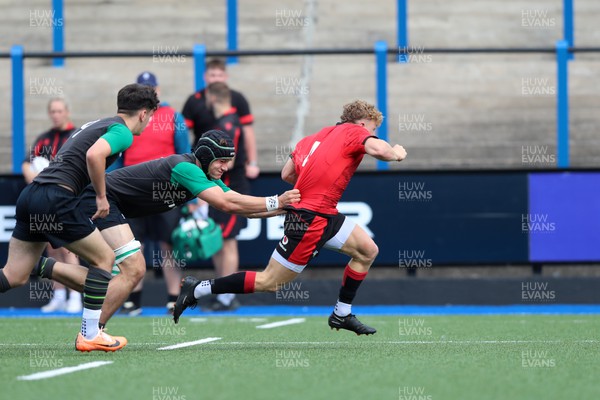 110823 - Wales v Ireland - U18 Festival of Rugby - Tom Bowen breaks an Ireland tackle 